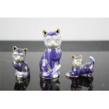A set of three blue champleve enamel cats.