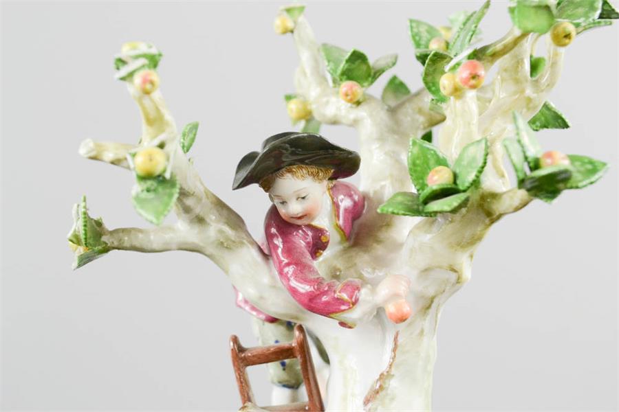 A Meissen 20th century figure group of young children playing in an apple tree, blue crossed sword - Image 2 of 6