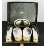 A Gentleman silver dressing set comprising four hand brushes and a circular bevelled plate