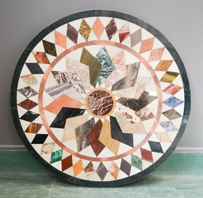 A pietra dura specimen marble table top, geometrically inlaid with various specimen marbles. 66cm