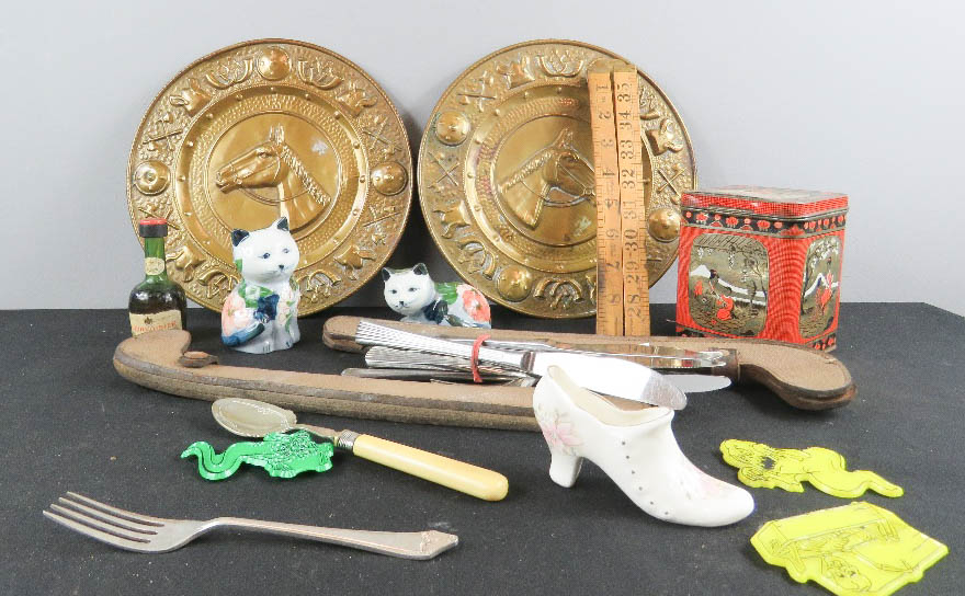 A group of collectibles including two brass embossed plaques, ceramic shoe etc.