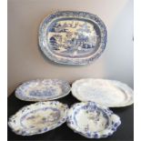 Three large blue and white plates and others.