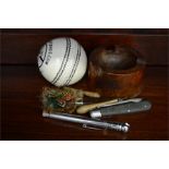 A Cricket ball labelled Lastmanstanding.com a Kookaburra County Star, together with penknives etc.