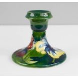 A Moorcroft candlestick, 9cm high.