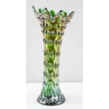 A Carnival glass vase in peacock iridescent colour, 32cm high.