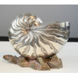 A silver plated spoon warmer in the form of a nautilus shell. 15cm high.