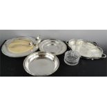 A group of silver plateware to include an hor d'oeuvres dish, bread board and stand, coaster etc.