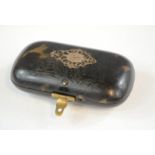 A 19th century tortoiseshell snuff box, inlaid with yellow metal decoration.