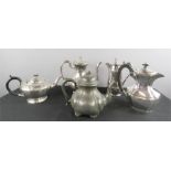 A group of silver plated tea pots, one in pewter.