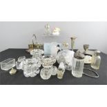 A quantity of glassware, silver plateware including salts, cruets, ceramic flowers etc.