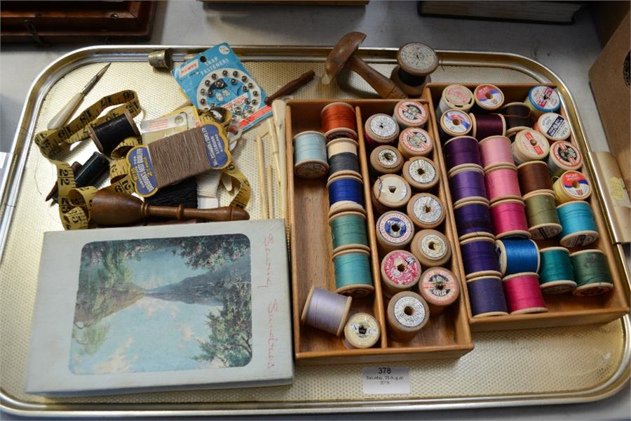 A quantity of cotton reels, sewing sundries, thimbles, darning, and a group of bone crochet