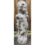 A reconstituted stone garden figure of a woman.