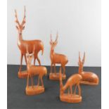 A group of carved treen deer.