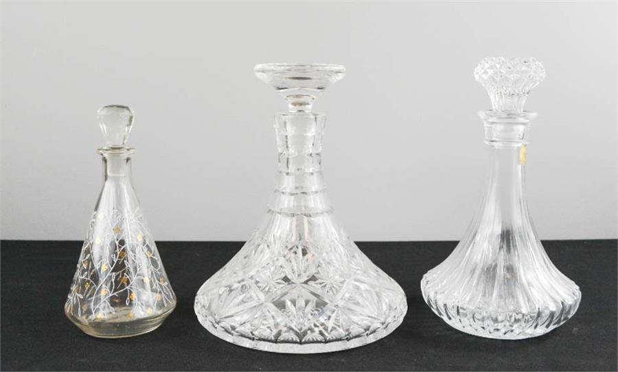 A cut crystal decanter French Cristal decanter and a small hand decorated decanter. (3)