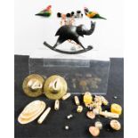 Two wooden carved and painted parrots, bone carved trinkets and beads, pair of symbols, and an