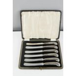 A set of six silver handled cake knives, in a presentation box.