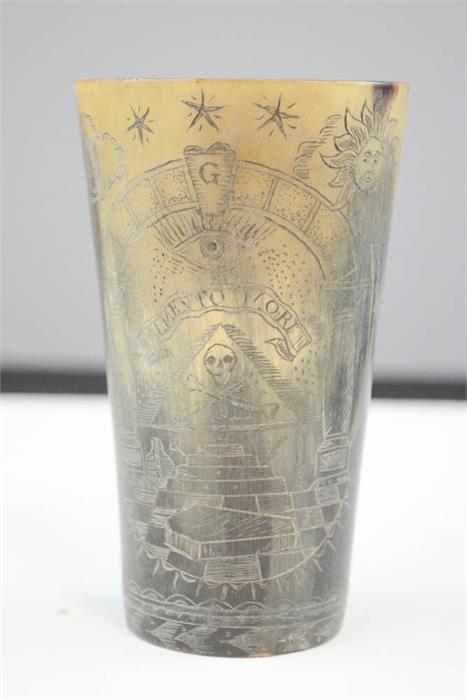 An early 19th century horn beaker, engraved with masonic and other symbols. 11cm high.