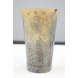 An early 19th century horn beaker, engraved with masonic and other symbols. 11cm high.