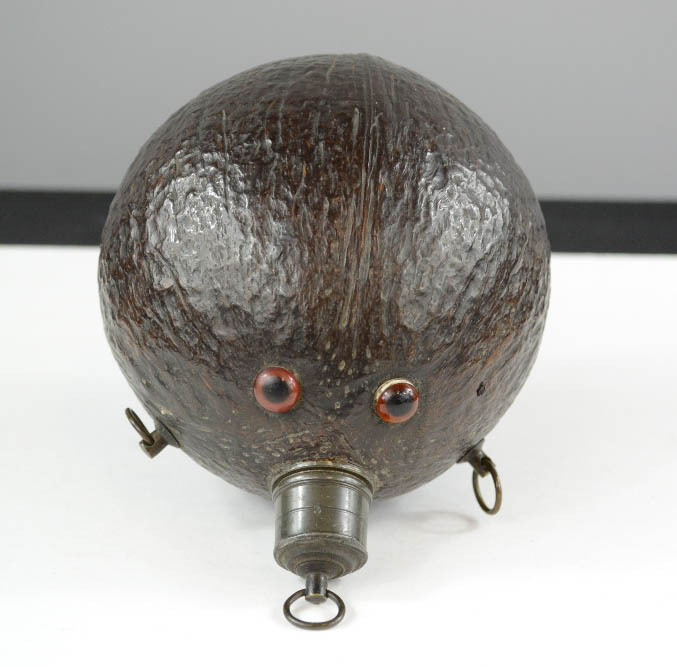 An antique coconut flask, inset with eyes. - Image 3 of 3