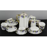 A porcelain Kronach-Bayaria Viktoria Luise coffee service, decorated with purple pansies and