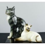 A Beswick cat no 1358, 18cm long, and a German porcelain cat no 2370 impressed to the base, 25cm