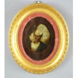 A Victorian crystoleum; oval portrait of woman wearing headdress, 16 by 13cm.