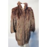 A fox fur 3¼ length coat.