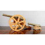 Two model cannons; early 20th century, one measures 25cm high, the other 11cm high.