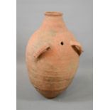 A large terracotta jar / water carrier, with twin handles, 57cm high.