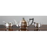 A silver tea set comprising tea pot, slop bowl, milk jug, Sheffield 1967, by William Hutton & Sons.