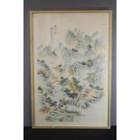 A Chinese gouache on silk depicting a landscape with mountains.