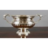 A silver plated wine cooler with lion headed ring handles, 18cm high, 25cm wide.