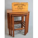 A nest of mahogany tables, together with an 'Onions & Garlic' pine rack/holder.