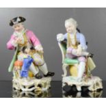 A pair of Meissen figures, blue crossed swords to the bases.