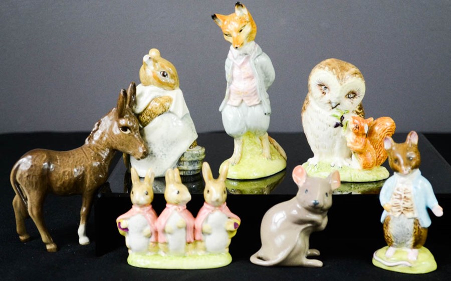 A group of Beswick beatrix potter and other figures.