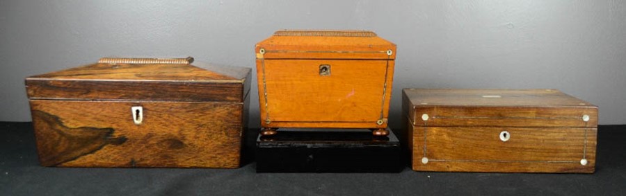 A group of three 19th century boxes, one mahogany work box, a rosewood and a satinwood tea caddy.