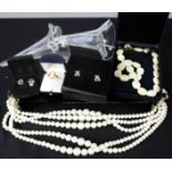 A mother of pearl necklace, two boxes of clip earrings, a cameo ring, five string simulated pearl