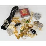 A quantity of costume jewellery to include earrings, egg form necklace, rings, charms, etc.