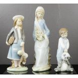 Three Lladro figures, girl with satchel, boy with panda and lady with lilies.