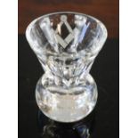 A Masons toasting cup etched with square set and compass emblem.