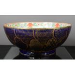 A Chinese 20th century bowl with cobalt blue and gilt decorated exterior.
