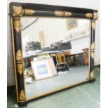 A 19th century ebonised and gilded wall mirror, the carved decoration gilded against the black