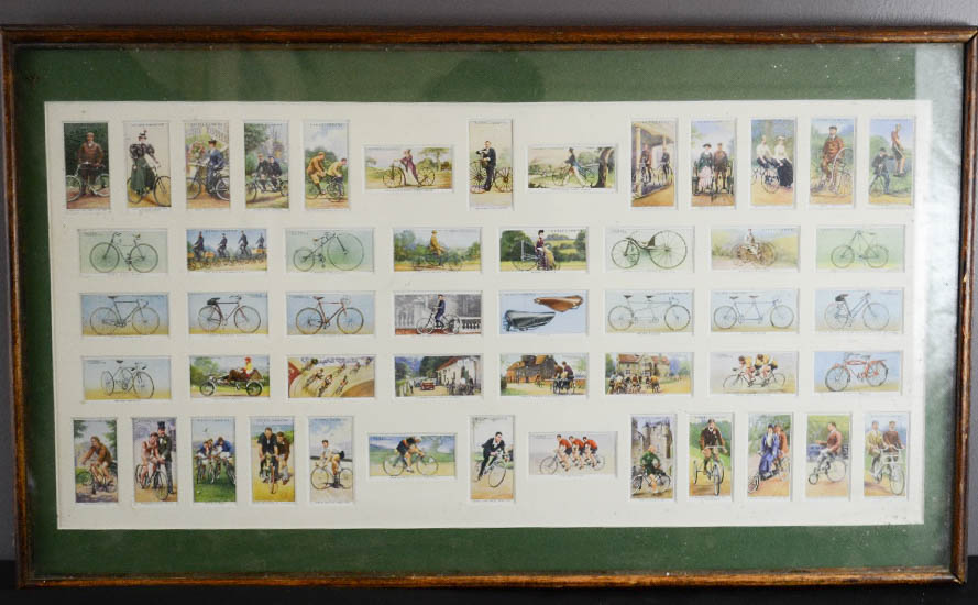 A framed set of Players cigarette cards, depicting bicycles.