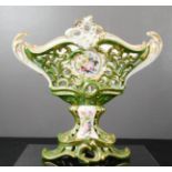 A hand painted porcelain pierced comport depicting flowers, possibly Hungarian, 24cm high.