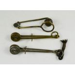 Thee antique Victorian skirt lifters.