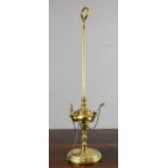 A 19th century brass oil burner, height adjustable.