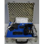 A photography case containing Carl Zeiss Jena DDR lenses and Praktica camera bodies.