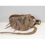 A 19th century dog baiting collar, with leather iron spikes.