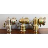 Four bicycle lamps; including Miller Carbo British Made and other examples.