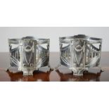 A pair of Art Nouveau style wine holders.